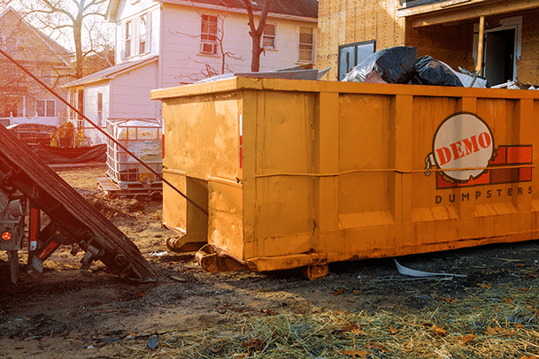 full demo dumpster on home construction site